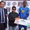 Charles Dzisah receiving cash prize for the man of the match  at the ONGC I-League held at JN Sports complex, Polo ground on Saturday